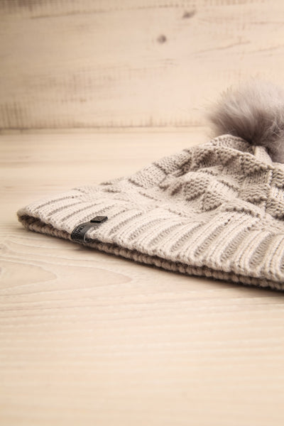 Honokaa Beige Knit Tuque with Faux-Fur Pompom flat view | La Petite Garçonne