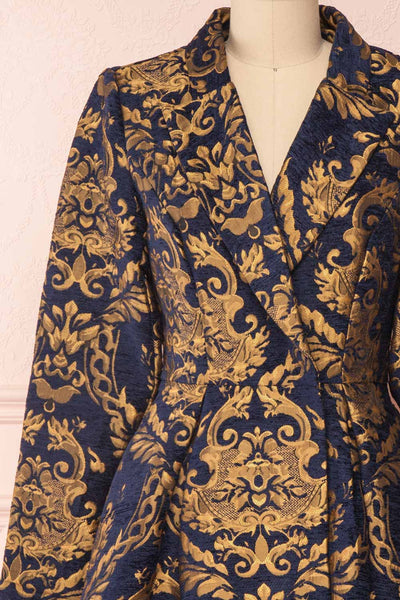 Hyleoroi Navy & Gold Jacquard Pleated Princess Coat | Boutique 1861 front close-up