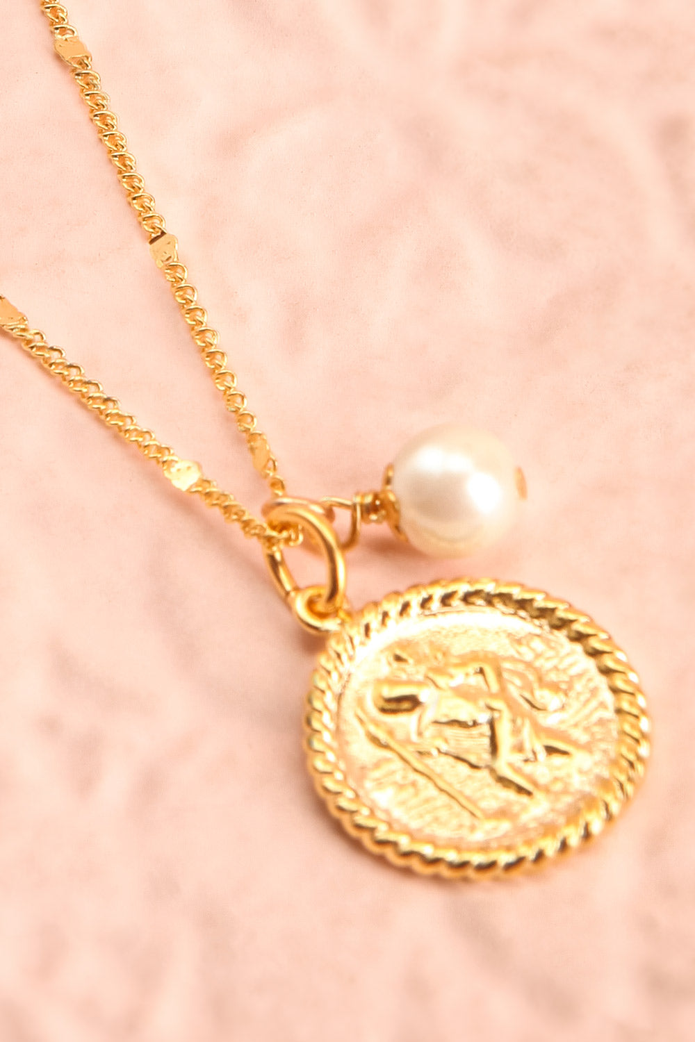 Jane Fonda Golden Medallion Pendant Necklace flat close-up | Boutique 1861
