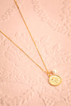 Jane Fonda Golden Medallion Pendant Necklace flat lay | Boutique 1861