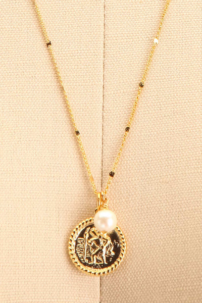 Jane Fonda Golden Medallion Pendant Necklace close-up | Boutique 1861