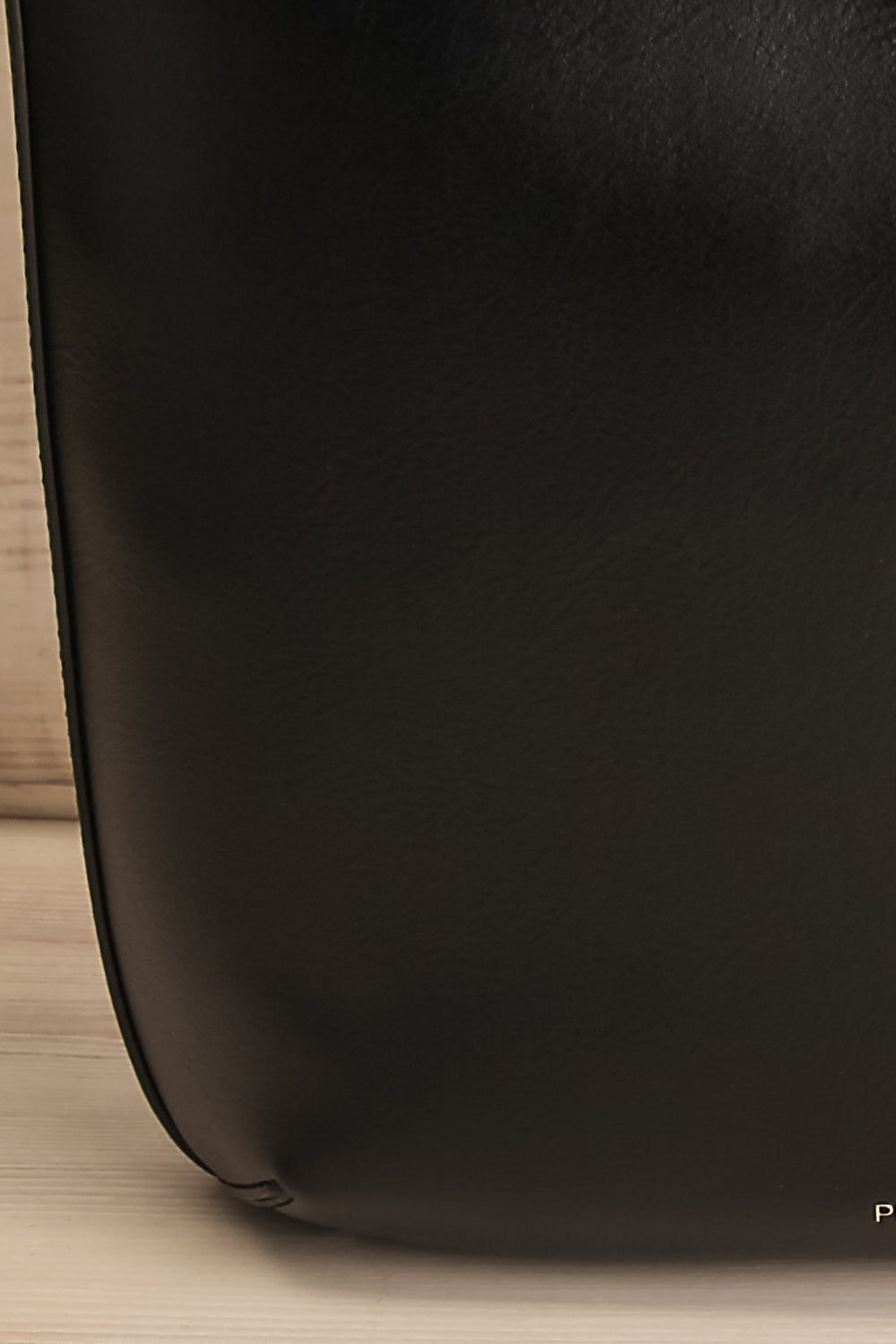 Kanacea Black Vegan Leather Backpack | La petite garçonne texture