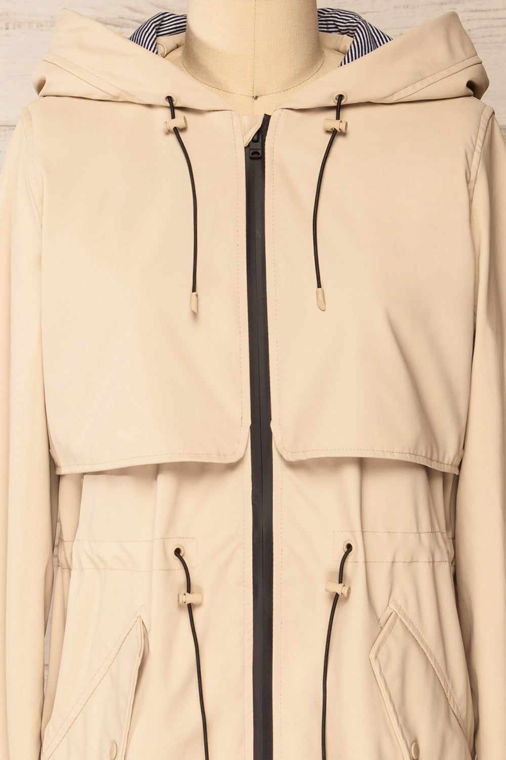 Kharokopion Beige Hooded Raincoat w/ Drawstring | La petite garçonne  front close-up