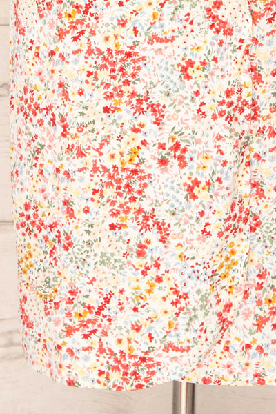 Kruszwica White Midi Floral Wrap-Dress | La petite garçonne bottom close-up