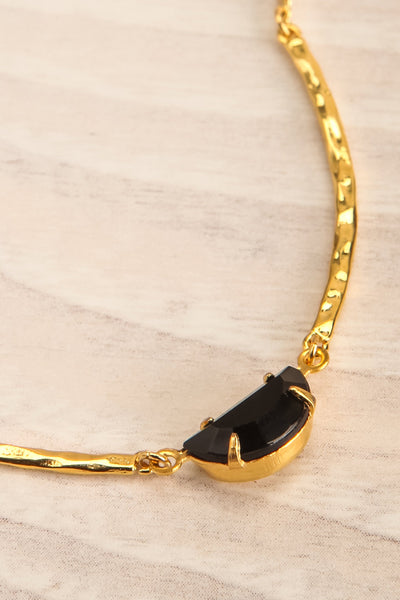Liza Minneli Black & Golden Pendant Necklace close-up | La Petite Garçonne
