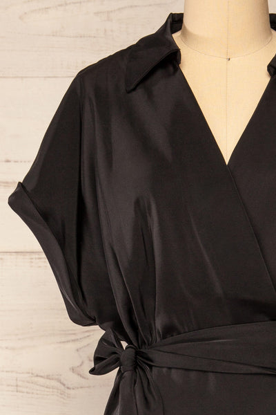 Maracay Short Sleeve Black Satin Wrap Midi Dress | La petite garçonne front close-up