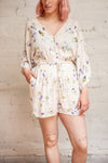 Mercy White Floral V-Neck Buttoned Romper | Boutique 1861 on model