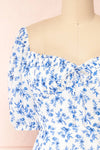Ouiza White & Blue Floral Midi Dress w/ Puffy Sleeves | Boutique 1861 front close-up