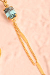 Paulettine Topaz Golden & Blue Pendant Earrings flat close-up | Boutique 1861