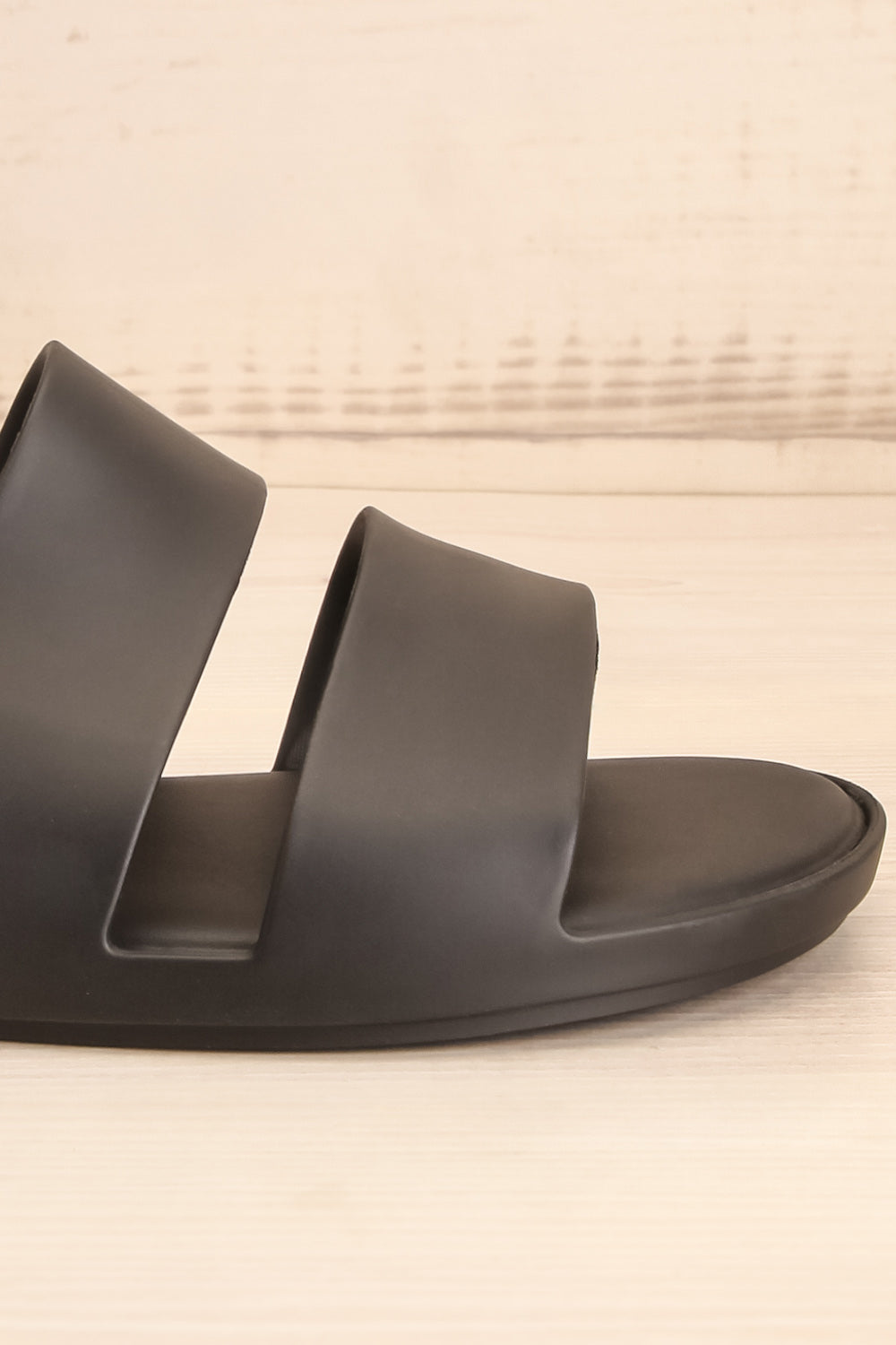 Pichincha Black Slip-On Sandals | La petite garçonne side close-up