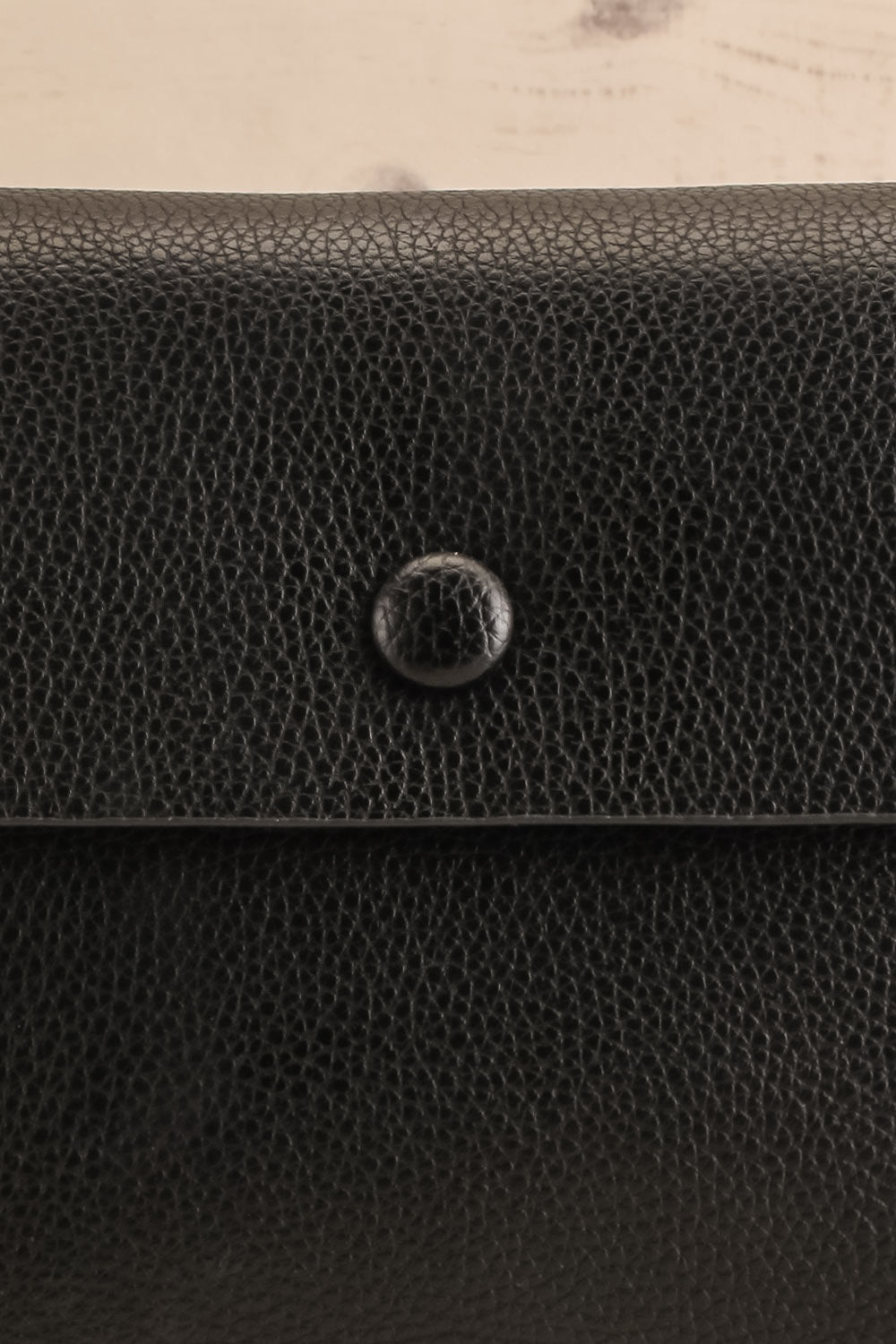 Puppis Black Textured Faux-Leather Handbag | La petite garçonne front close-up