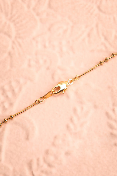 Renée Claire Golden Pendant Necklace | Fleur | Boutique 1861 closure close-up