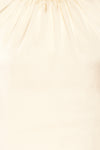 Riccia Cream Sleeveless Pleated Neck Blouse | La petite garçonne texture