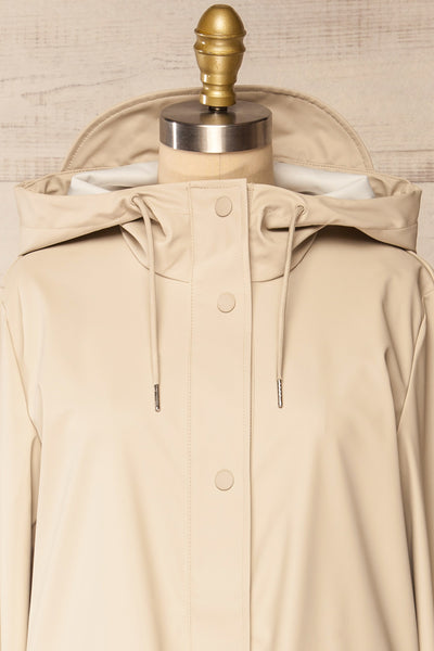 Rochester Beige Button Up Hooded Raincoat | La petite garçonne front close-up