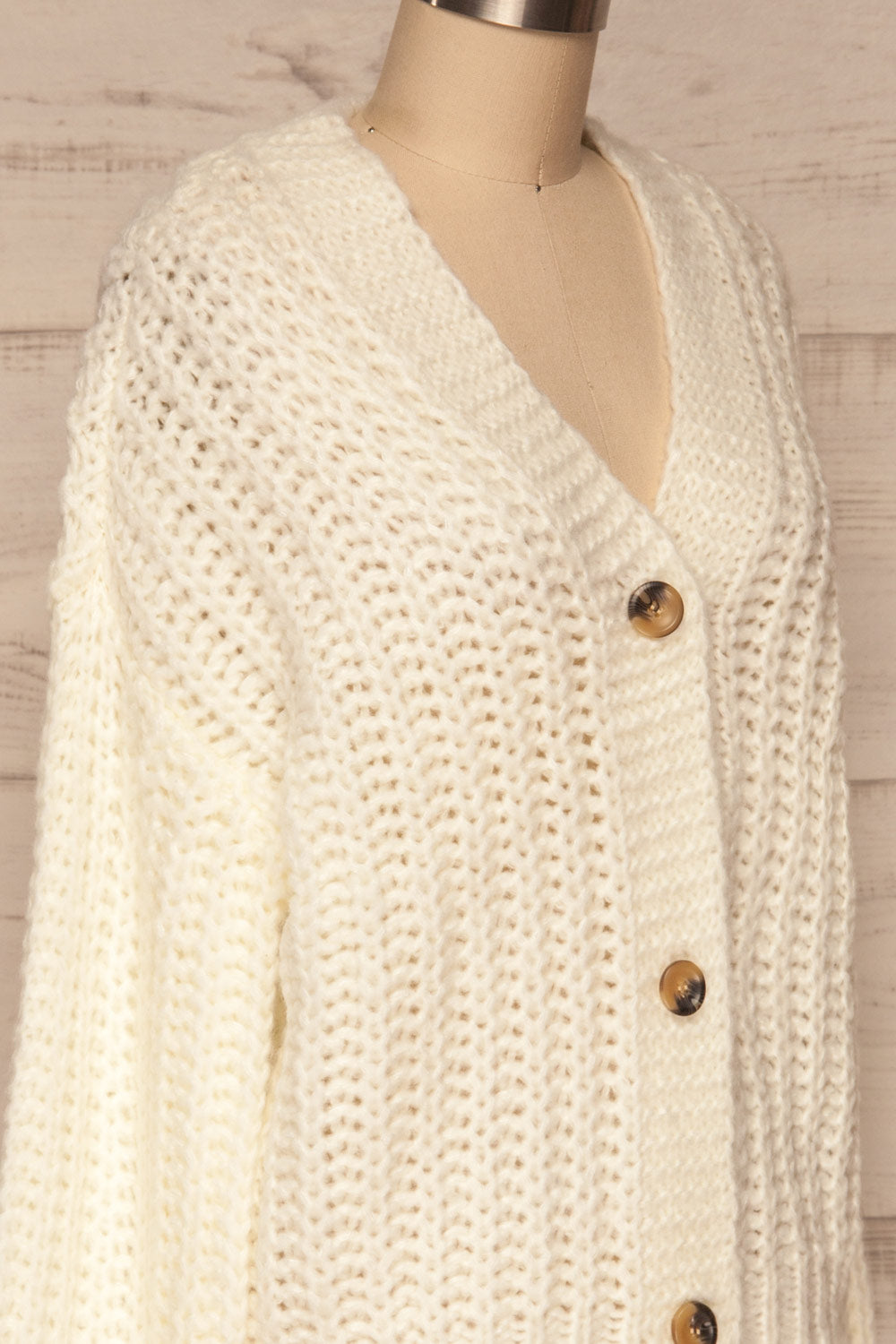 Tioumen Ivory Chunky Knit Button-Up Cardigan side close up | La Petite Garçonne