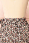 Varinia Black Patterned Ruffle Short Wrap Skirt | Boutique 1861  back close-up