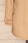 Varna Beige Parka Coat with Faux Fur Hood | La Petite Garçonne bottom close-up