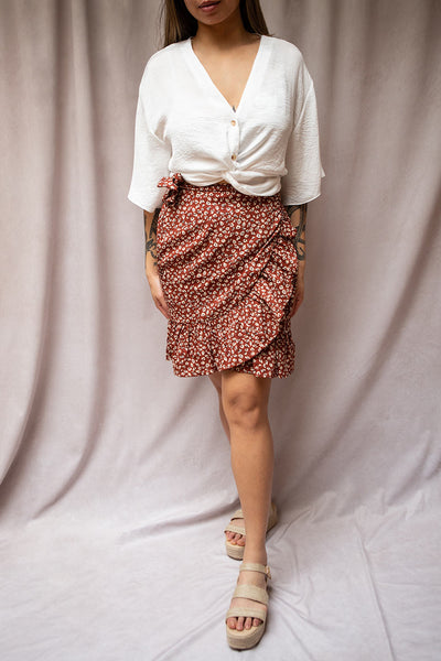 Varinia Brown Patterned Ruffle Short Wrap Skirt | Boutique 1861 on model